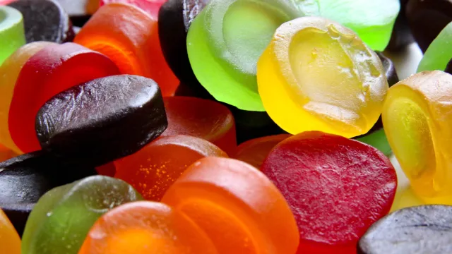 Colorful assortment of round fruit-flavored candies.